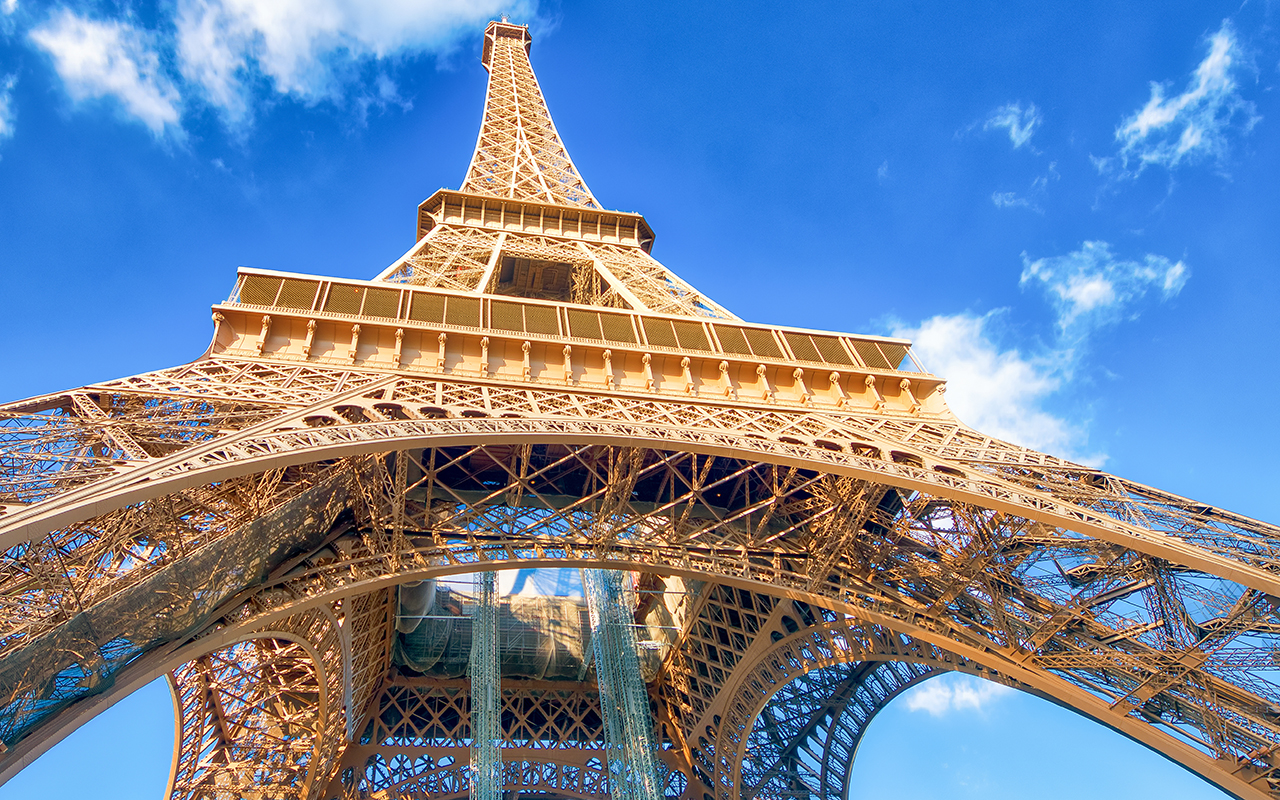 Upward view of Eiffel Tower on a beautiful sunny winter day - Paris - France
