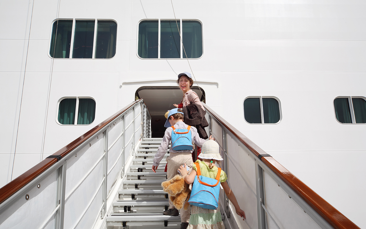 Family stepping onto a cruise ship