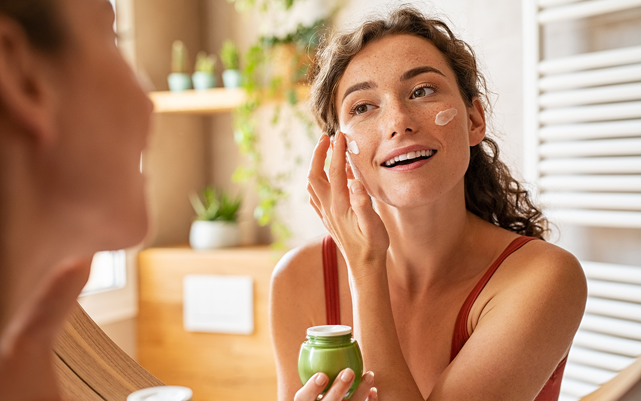 Woman applying skincare