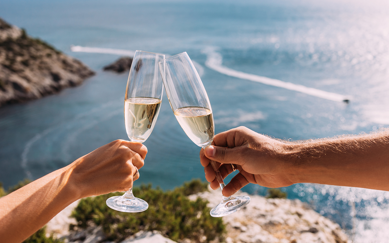 Champagne glasses on the beach