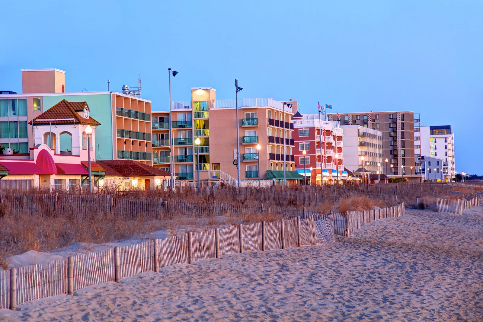 Colorful beachfront homes and hotels in Rehoboth Beach, Delaware, lining the sandy shore.