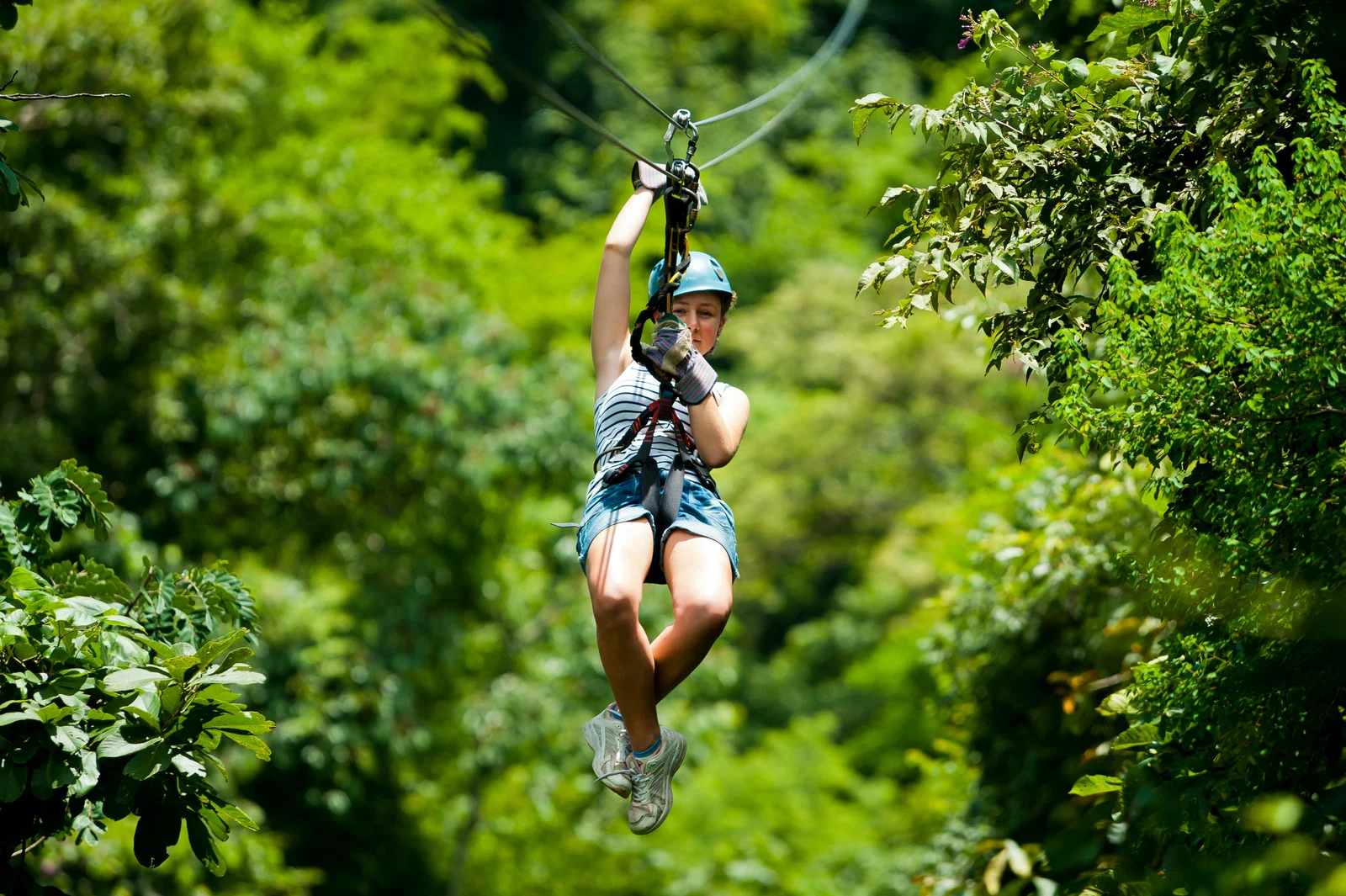 Woman zip-lining 