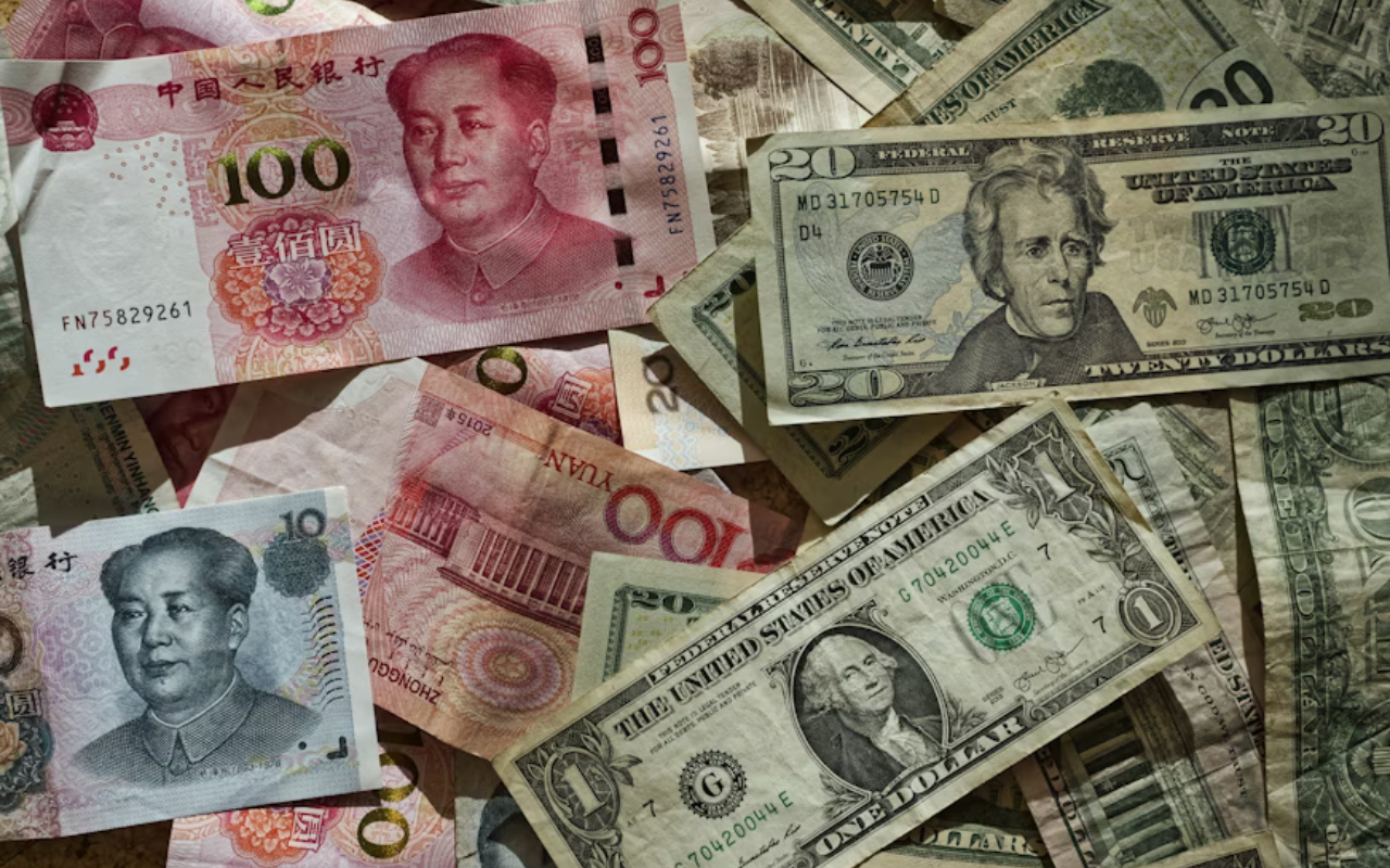 Money in various currencies scattered on a table