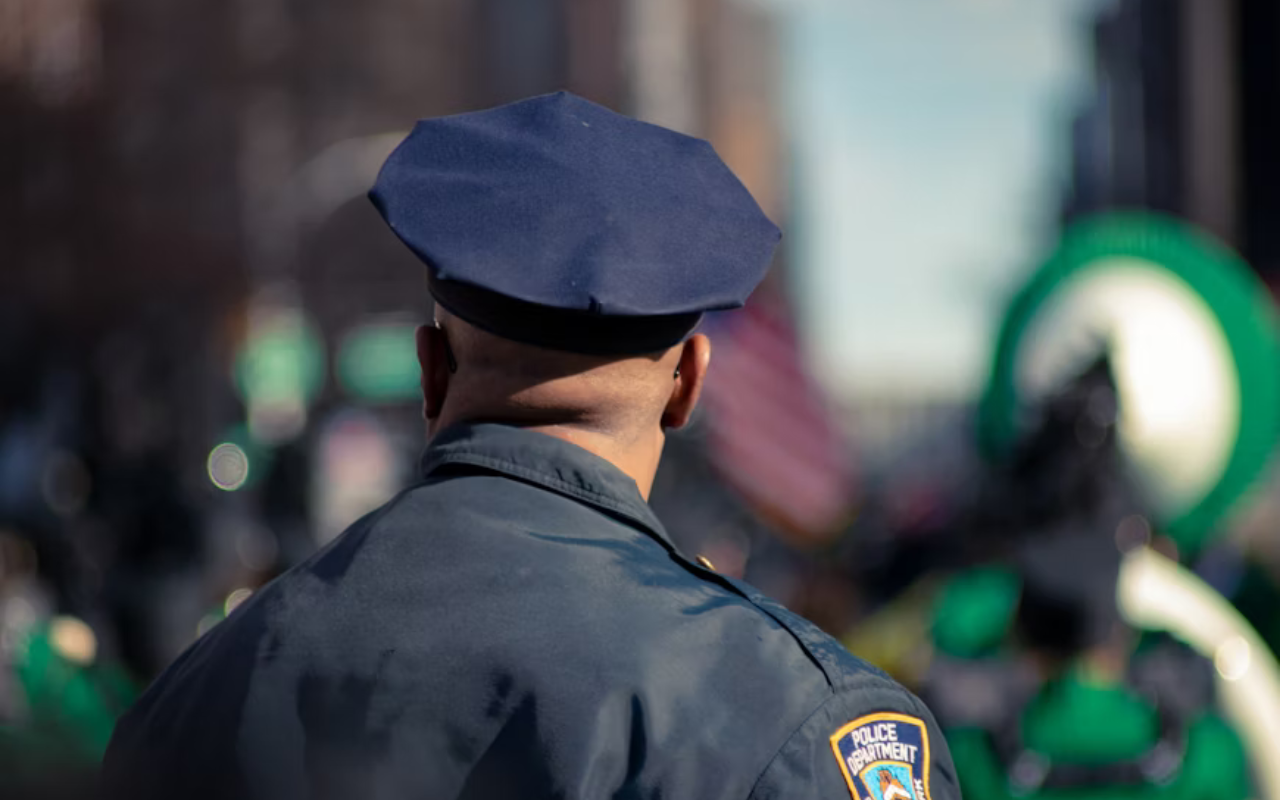 Rear-view of a man in a police officer uniform