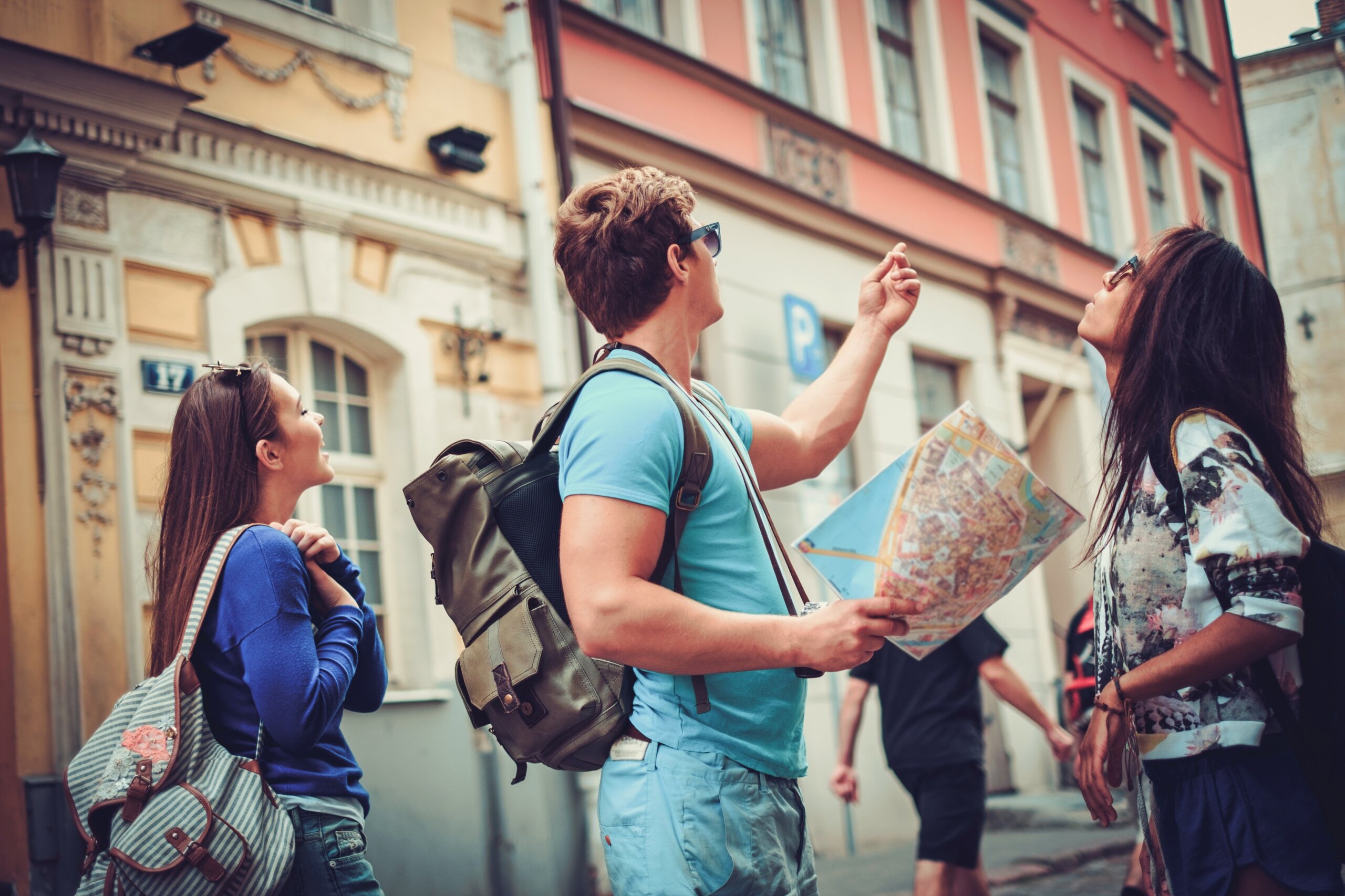 American tourists with a city map in a historic old town during international travel.