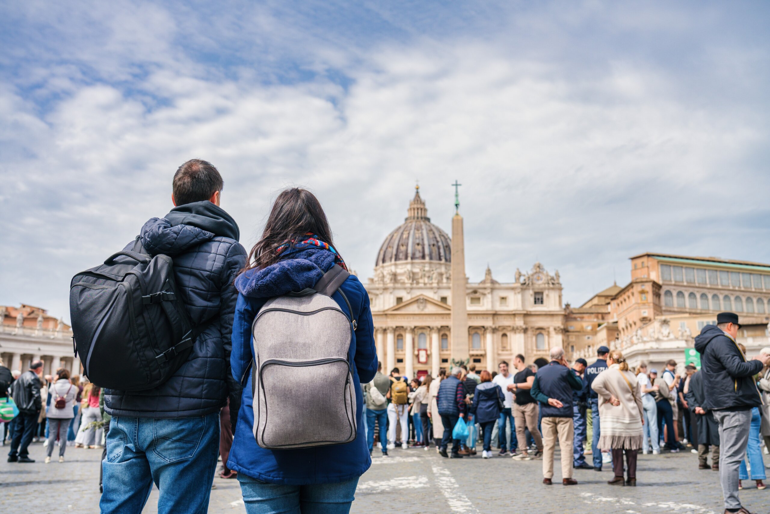 Tourists couple visit Vatican city and St. Peter's Basilica church in Rome. Italy