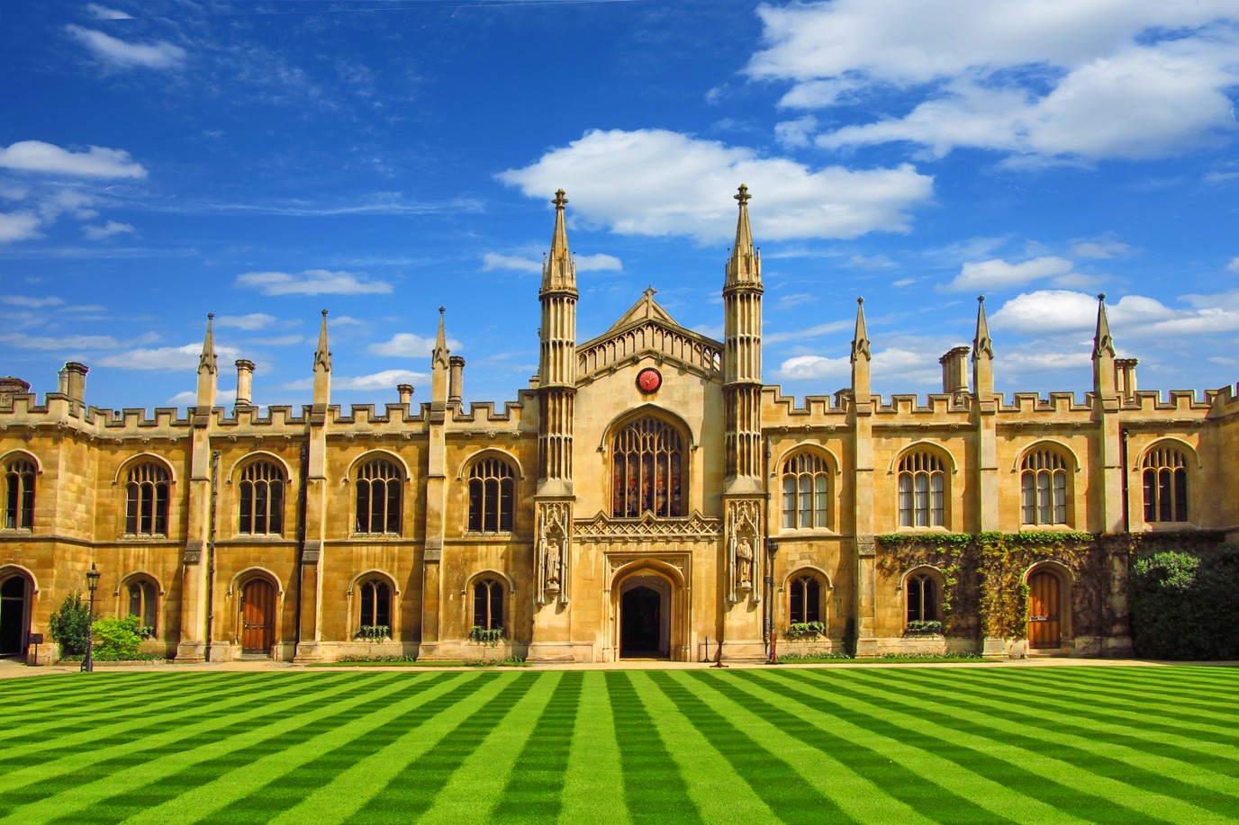 university in Cambridge with a beautiful lawn under a blue sky on a sunny day in summer