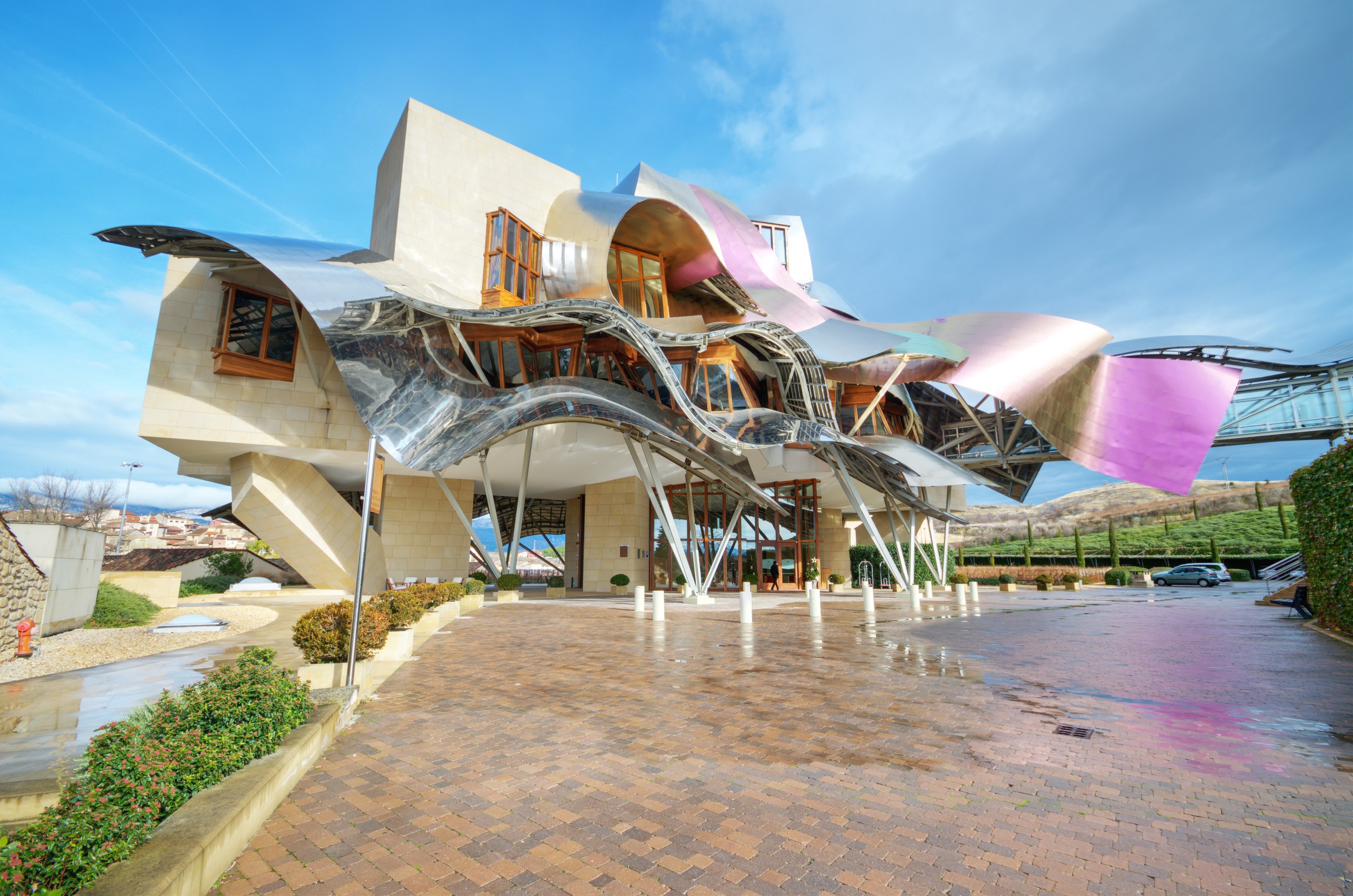 Elciego, Alava, Spain; march 28th 2024: Front view of a modern building with wavy aluminum structures designed by the architect Frank O. Gehry, for the Rioja wine cellars called Marques de Riscal