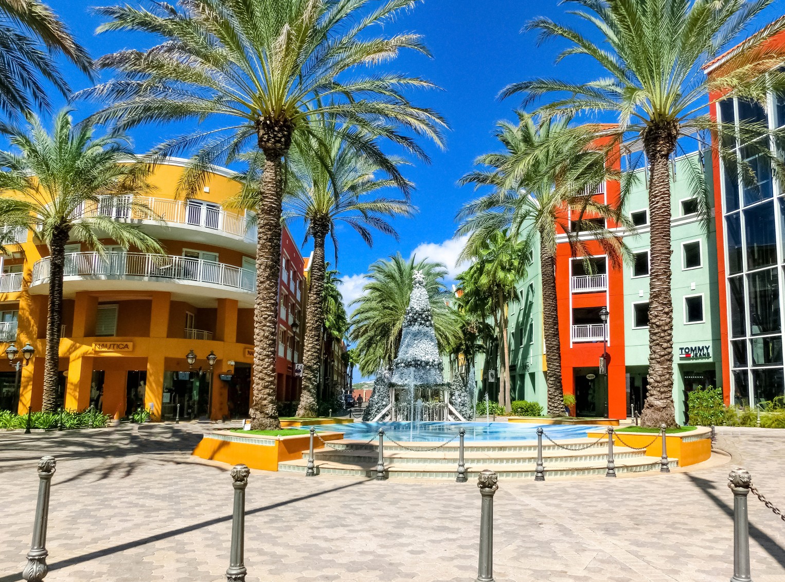 Willemstad, Curacao, Netherlands - December 5, 2019: Specific coloured buildings on Handelskade street in Curacao