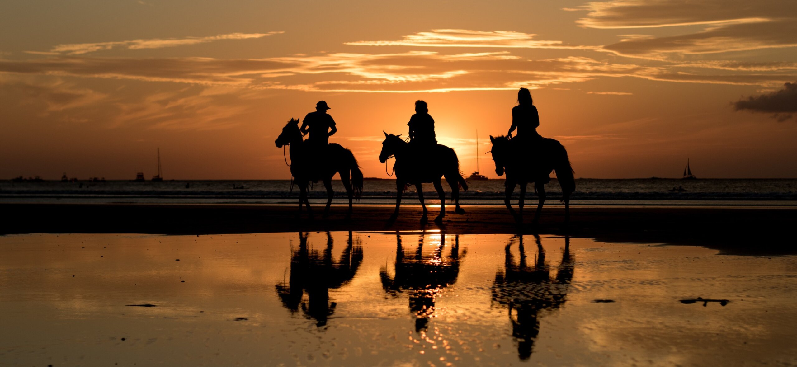 Sunset horseback riding on Tamarindo beach Costa Rica – romantic adventure honeymoon destination 2025