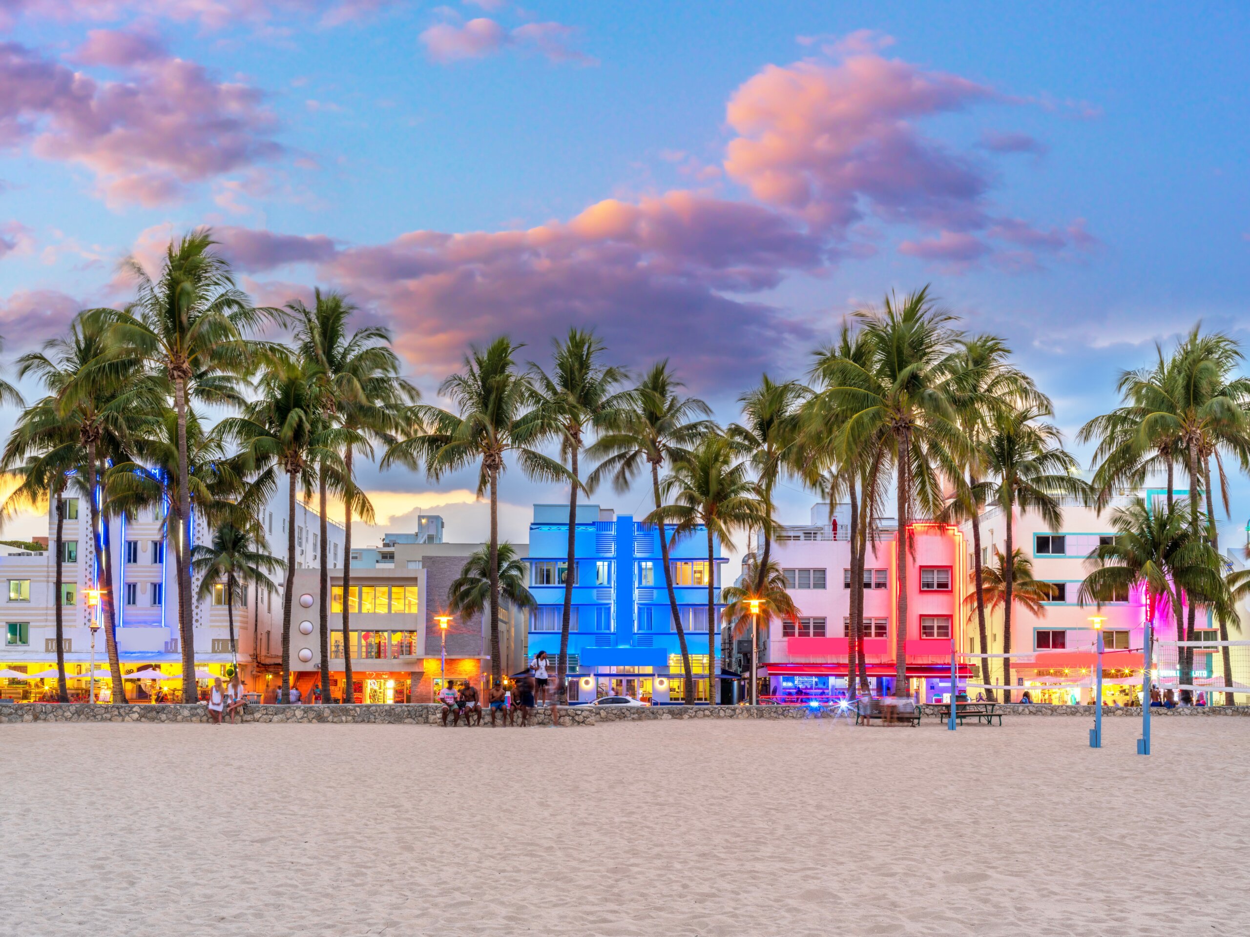 Ocean Drive’s colorful Art Deco buildings in Miami under a bright blue sky, reflecting the city’s vibrant culture and diverse influences.