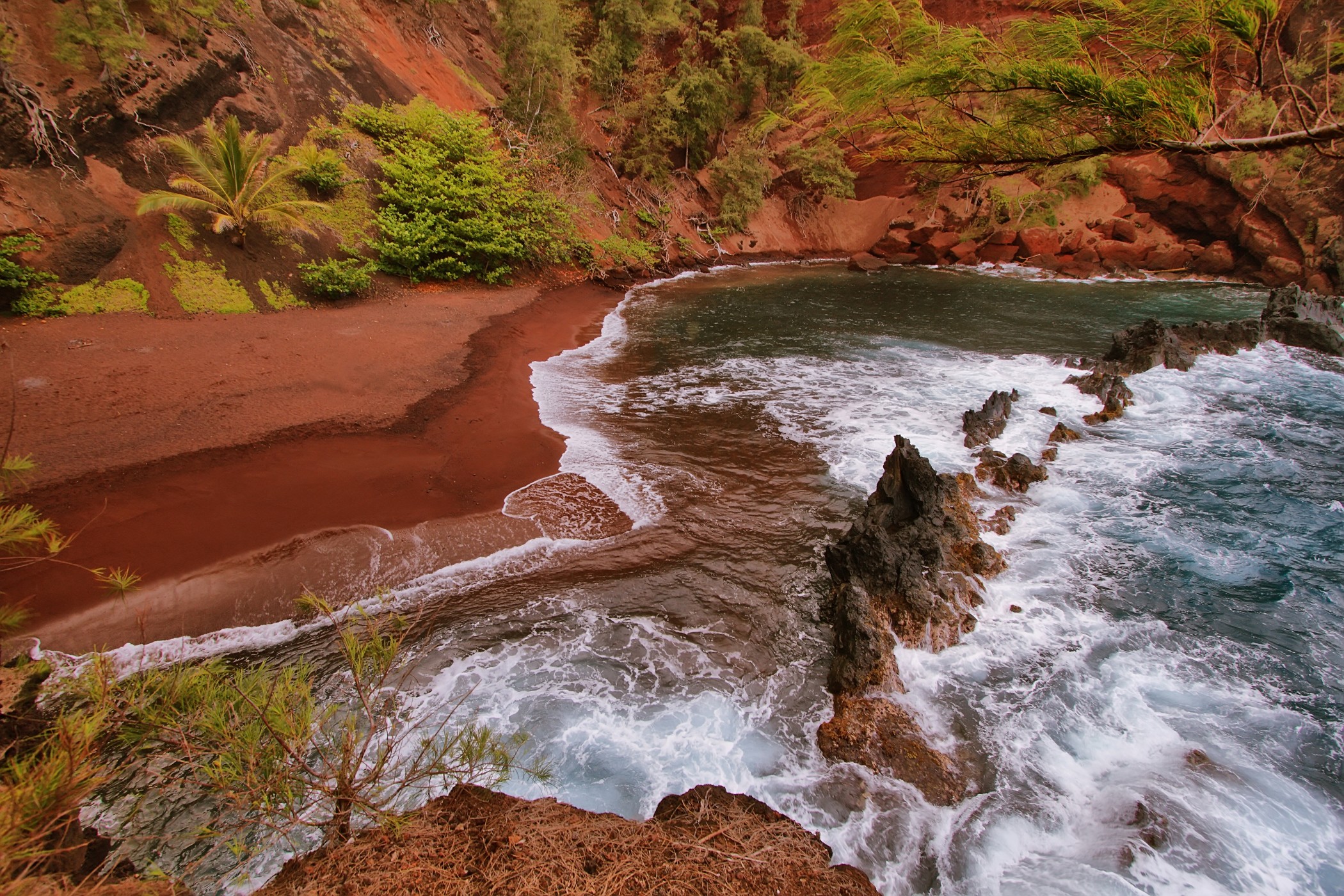 Kaihalulu red sand beach.