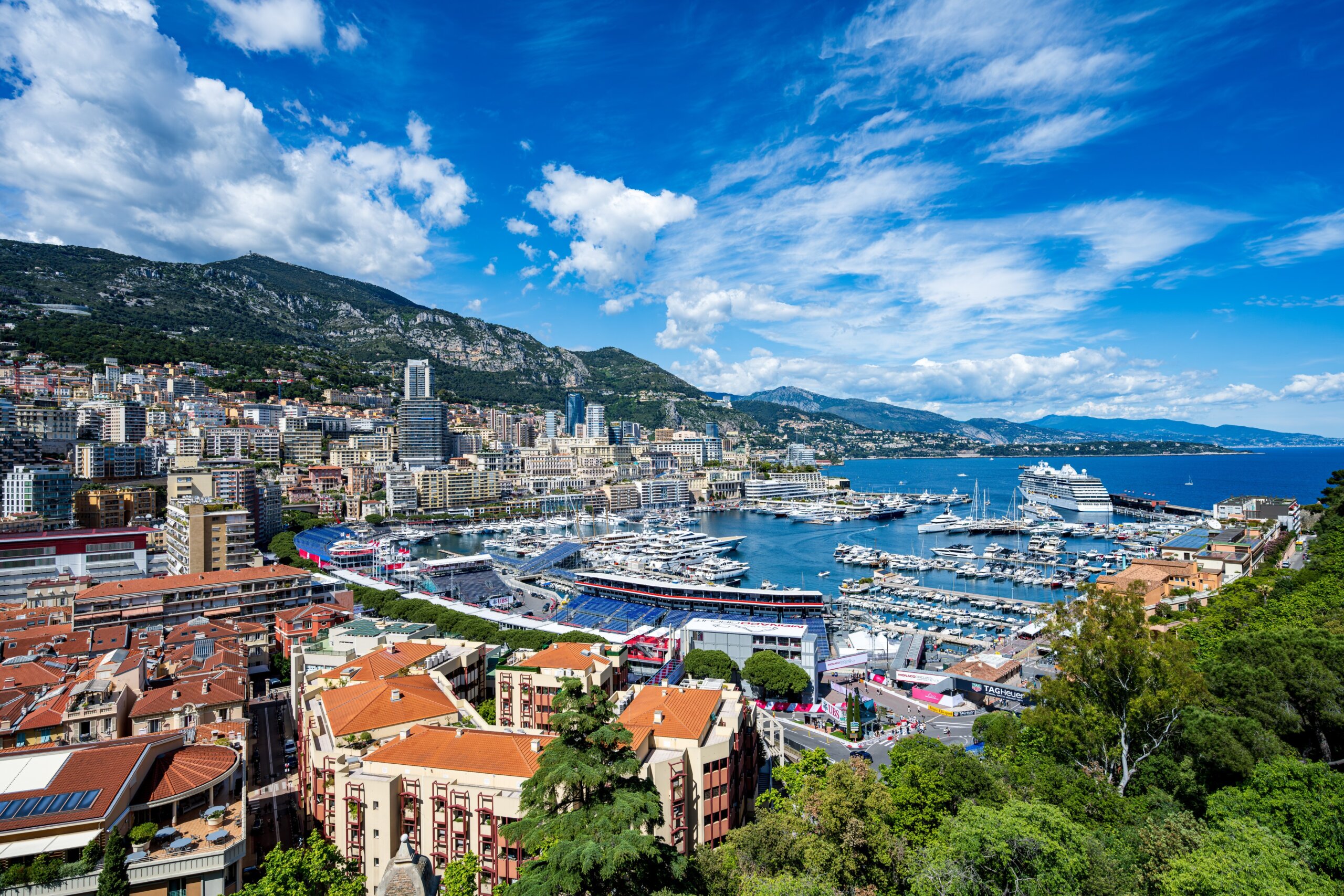 View of Monaco Grand Prix race track from behind with city and harbor in the background