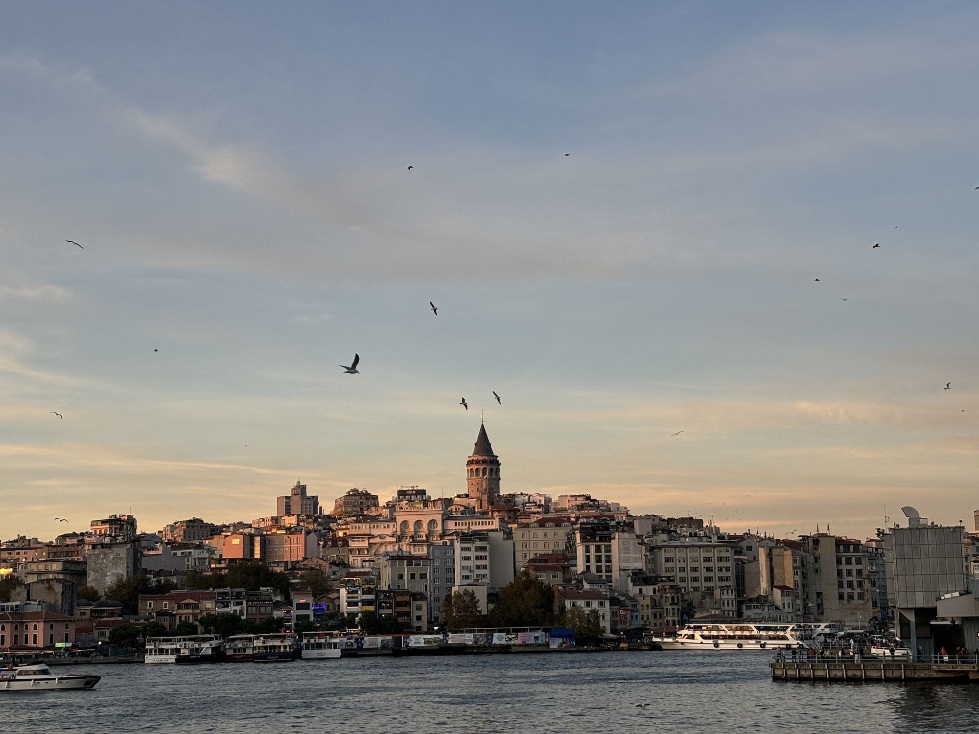Istanbul, Türkiye: Istanbul at sunset on the bridge. When all of the people are crowded in one chaotic space. 