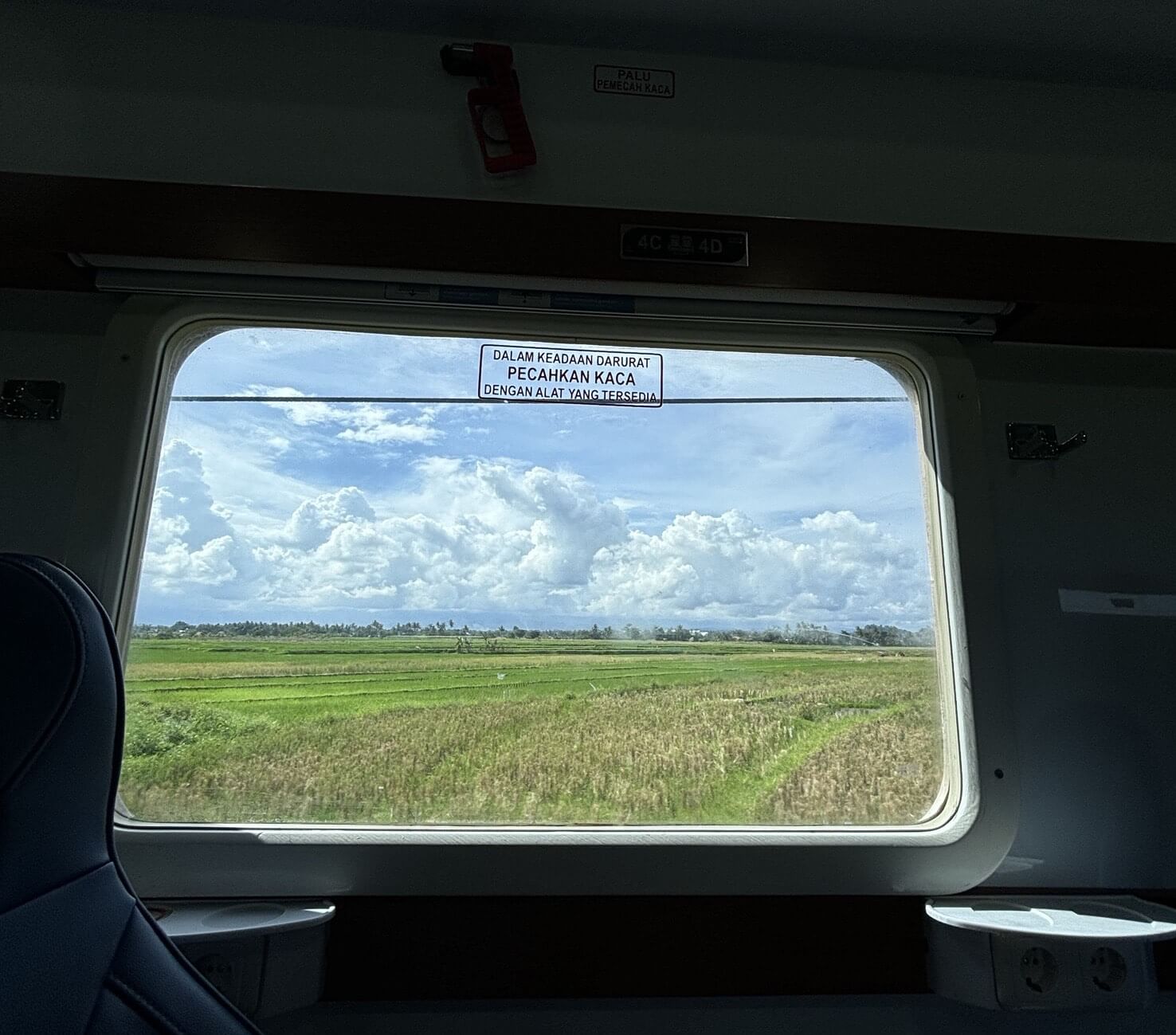 Rural Java views during a train ride in Indonesia.