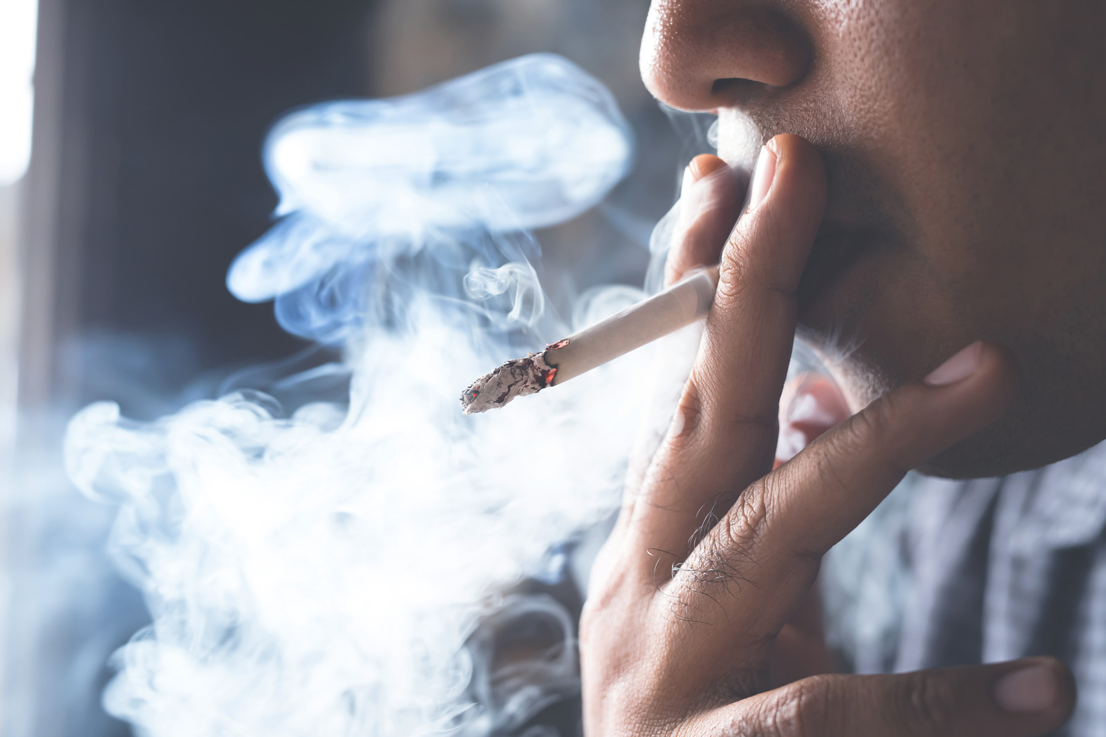 Man smoking a cigarette.
