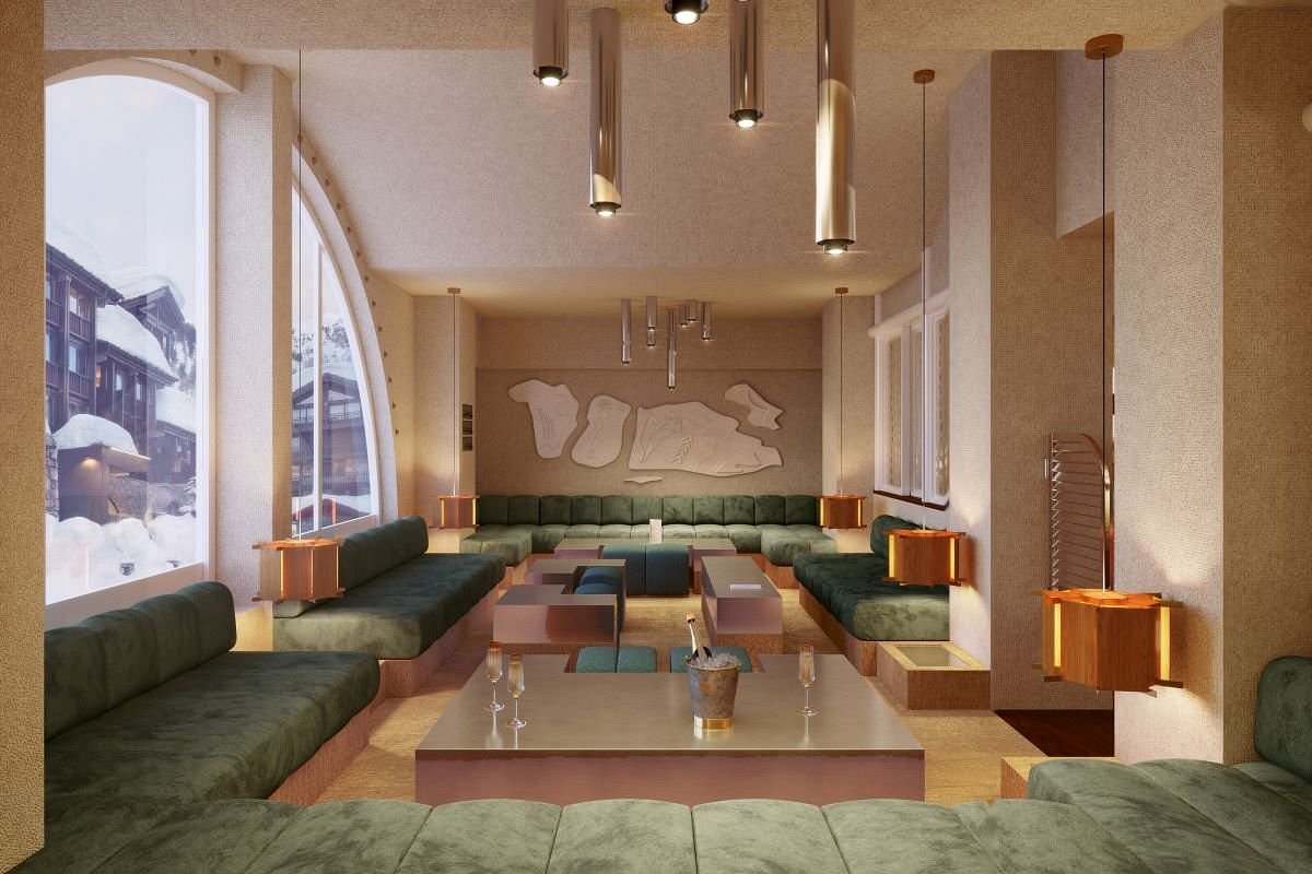 Modern-luxury interior of a common area outlined with plush green velvet counches and natural wood accents at the Experimental Chalet Val d'Isère, France