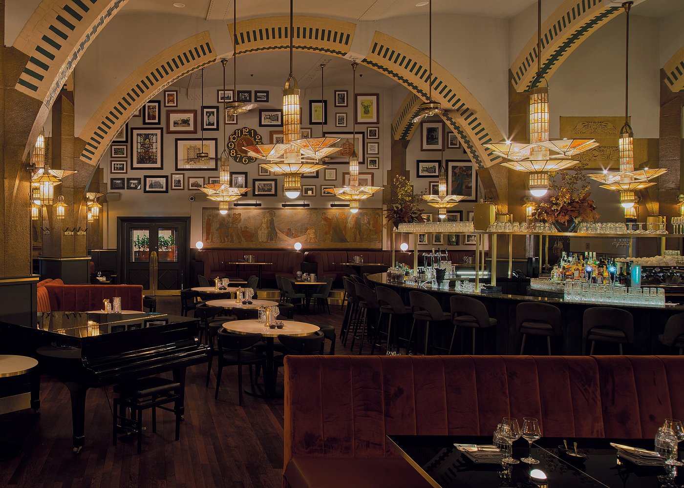 Art Deco café in Amsterdam with stained-glass windows and elegant historic interiors.