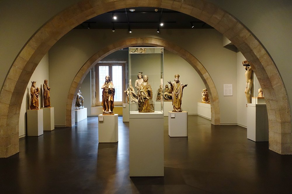 Interior of Museu Frederic Marès in Barcelona showcasing antique sculptures, historic artifacts, and unique collectibles.