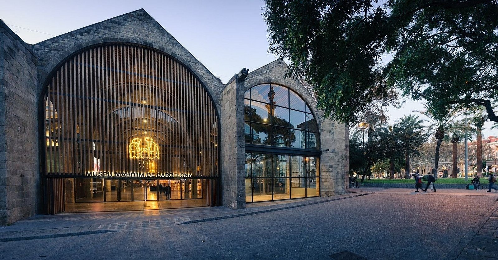 Maritime Museum of Barcelona in historic Royal Shipyards with grand Gothic arches and restored sailing ship Santa Eulàlia.