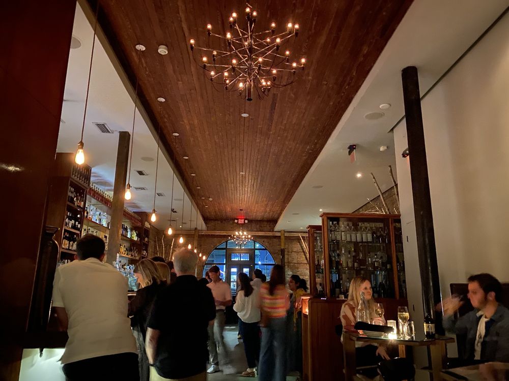 Interior of Cure bar in New Orleans – chic modern cocktail bar in a historic building with stylish, welcoming ambiance