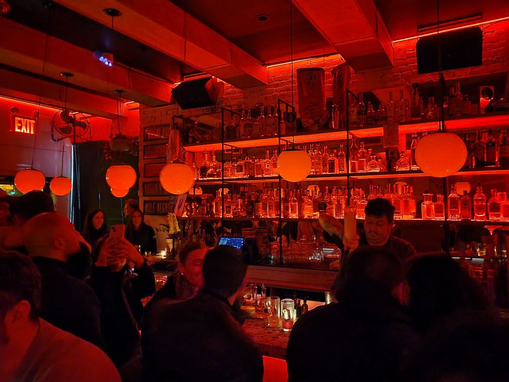 Interior of Superbueno bar in East Village NYC – lively agave-focused cocktail bar with colorful modern design