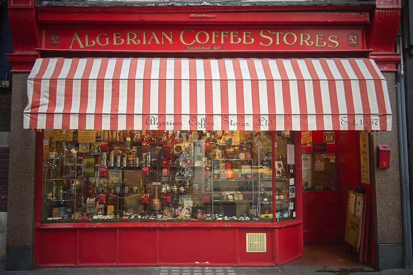 Historic coffee shop in London’s Soho filled with vintage wooden shelves and fresh beans.