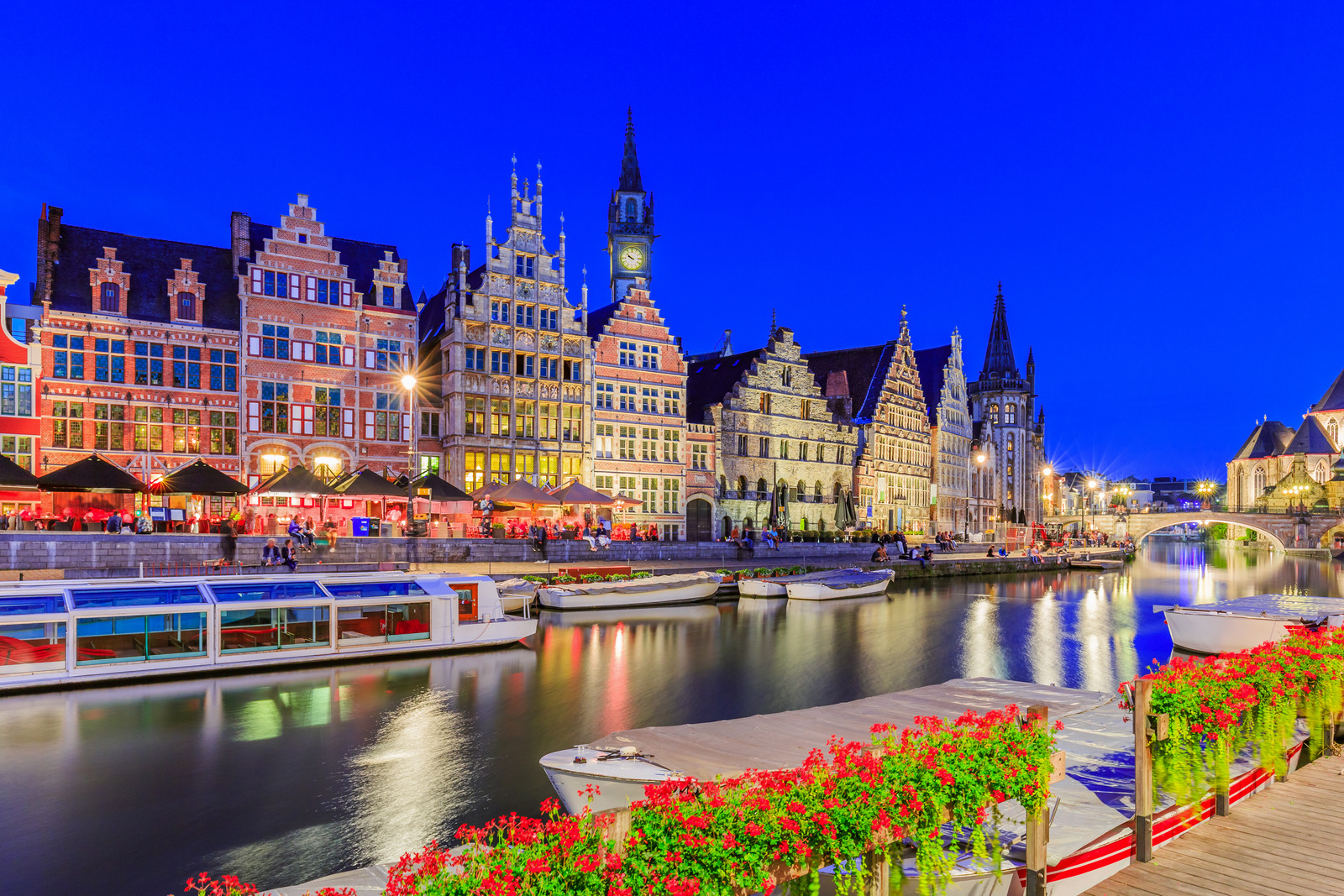 View of Graslei quay and Leie river in the historic city center in Ghent (Gent), Belgium. Architecture and landmark of Ghent. Cityscape of Ghent.