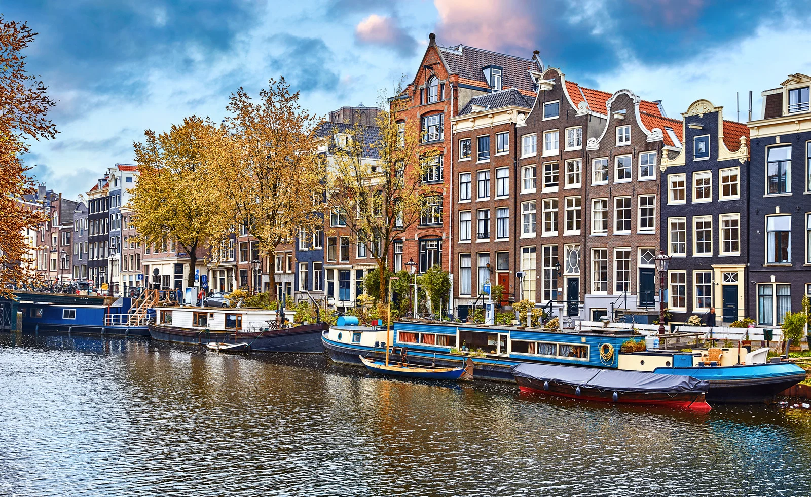 Amsterdam Netherlands dancing houses over river Amstel landmark in old european city spring landscape.