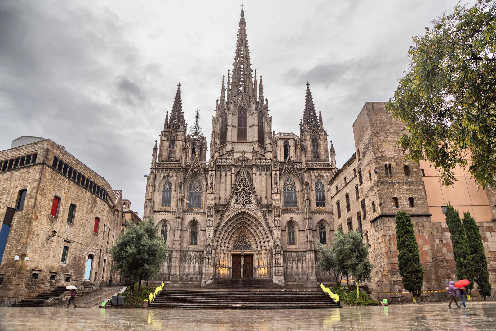 Gothic Cathedral of Barcelona with intricate stone facade, tall spires, and historic cloister in the Barri Gòtic district.