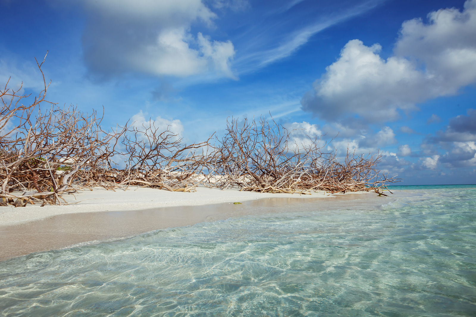 Fulhadhoo, Maldives – Remote white sand and bright blue water at Fulhadhoo Island, Maldives.