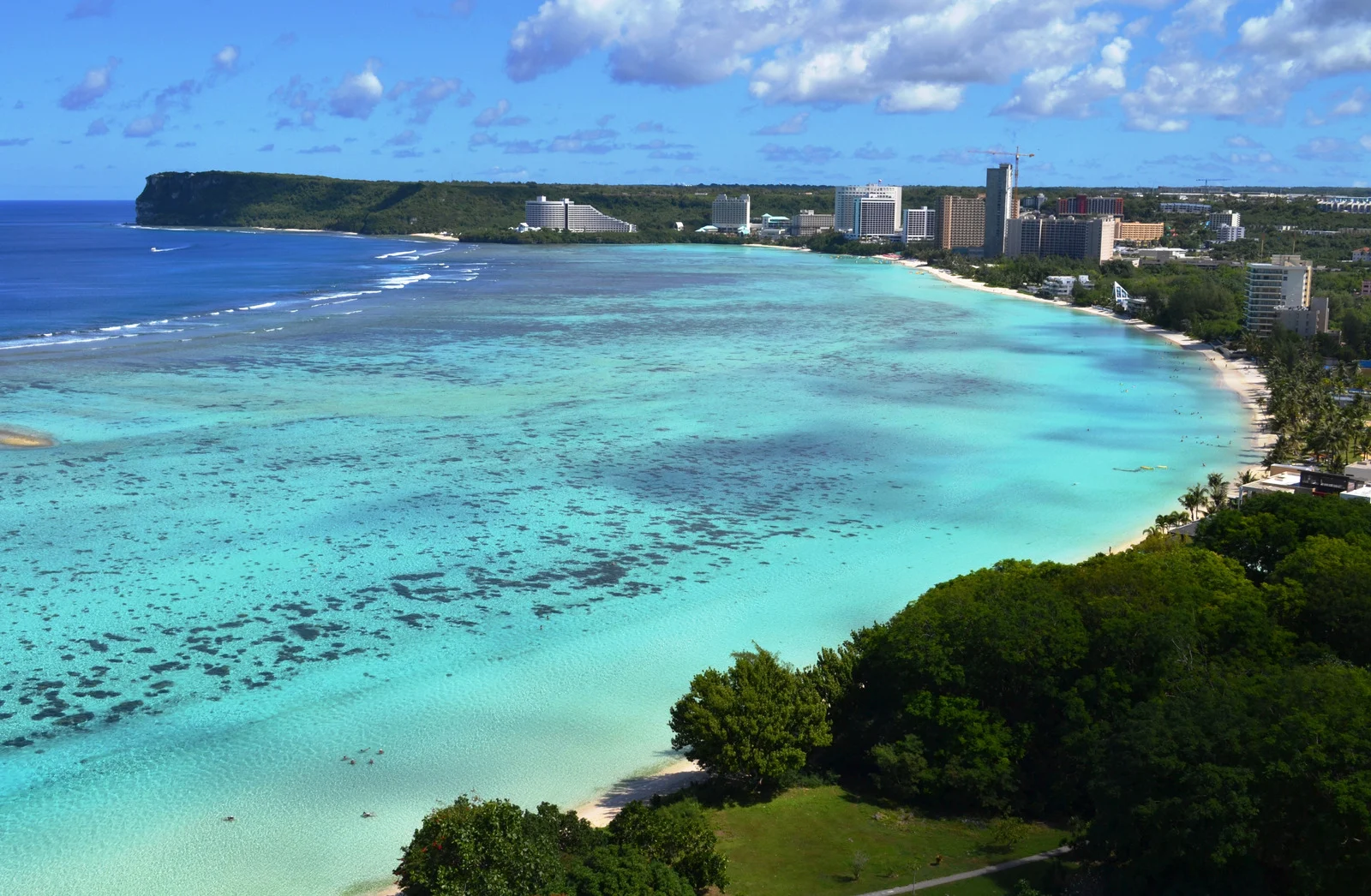 Ypao Beach, Tumon, Guam – Crystal-clear turquoise water at Ypao Beach in Tumon, Guam, perfect for snorkeling and family picnics.