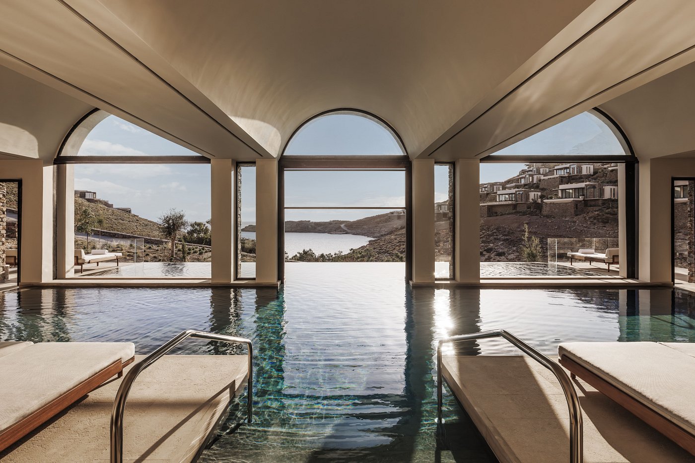 One&Only Kéa Island, Greece - Infinity pool overlooking a gorgeous view of the sea framed by massive arched windows