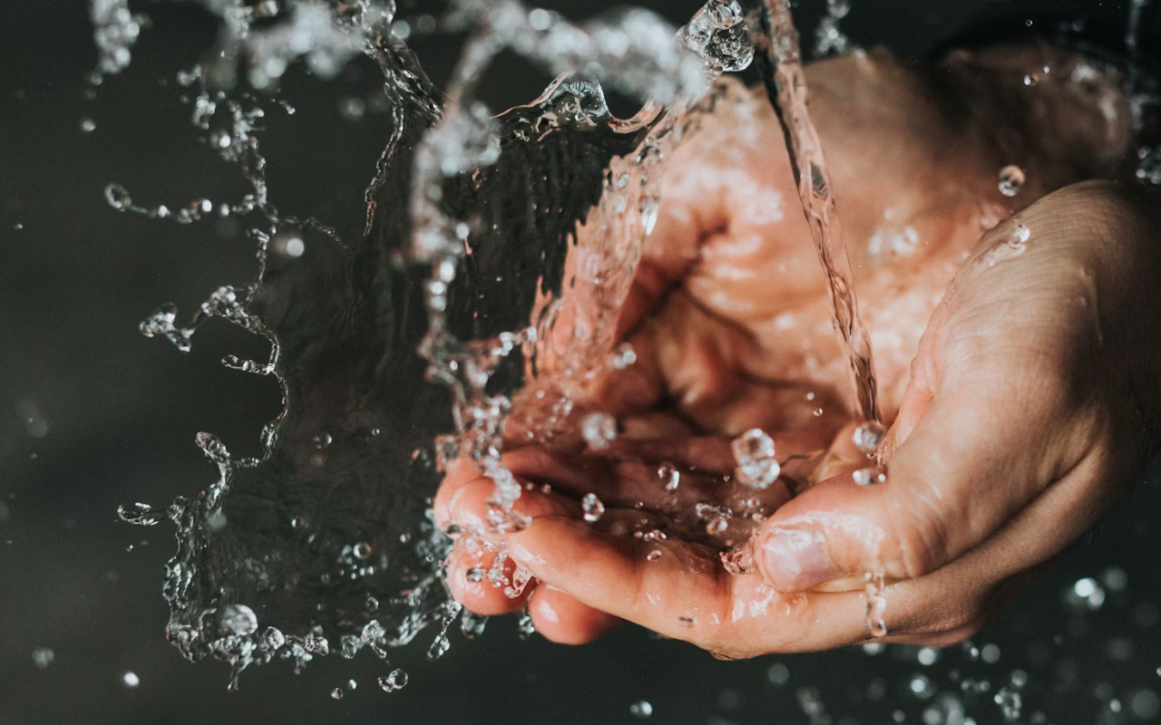 Man washing hands to protect health