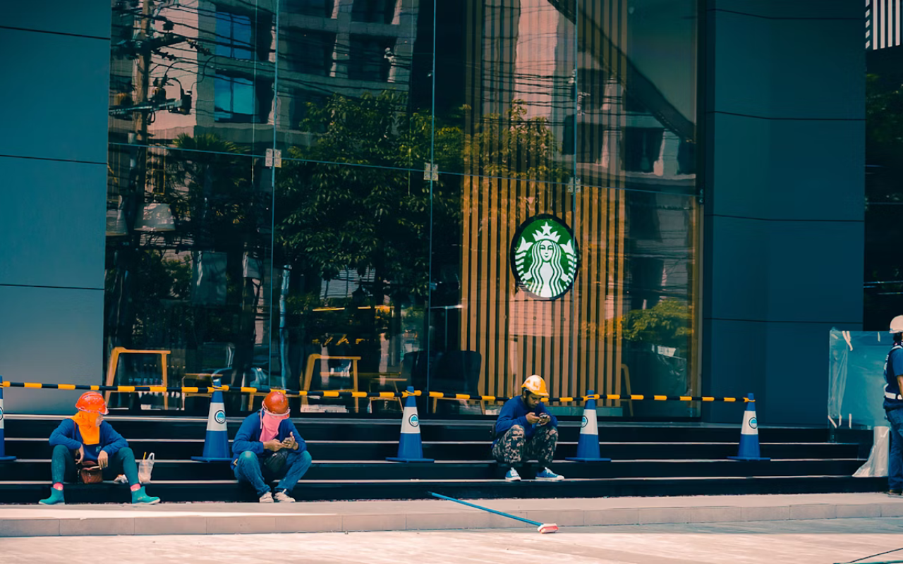 people sitting on steps a healthy distance apart to ensure health protection