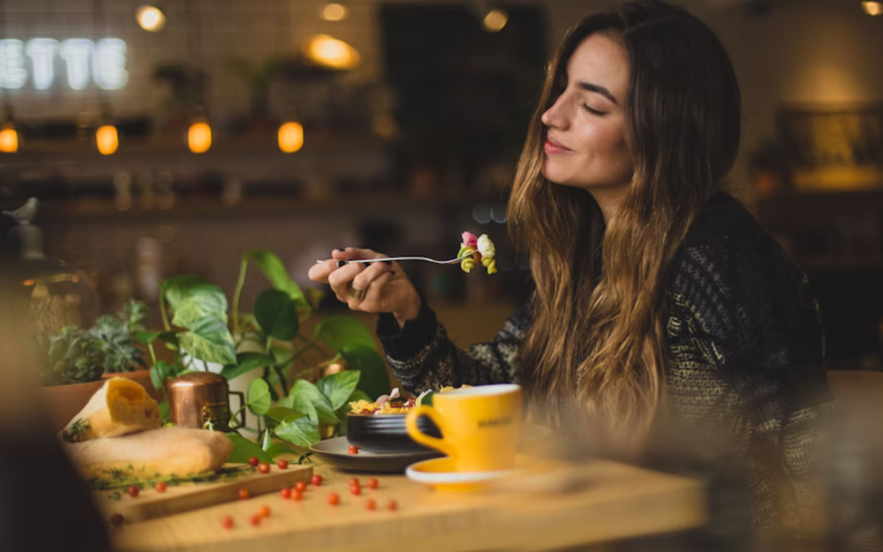 Woman enjoying a healthy dinner while traveling