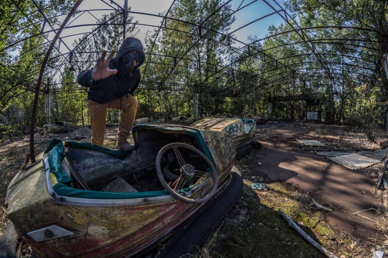 The ghost city of Pripyat, Ukraine, abandoned after the 1986 Chernobyl disaster, features haunting sights like a deserted amusement park and decaying buildings.