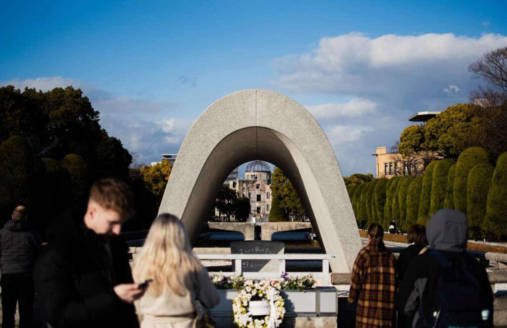 Hiroshima Peace Memorial Park with cenotaph and A-Bomb Dome in Japan.