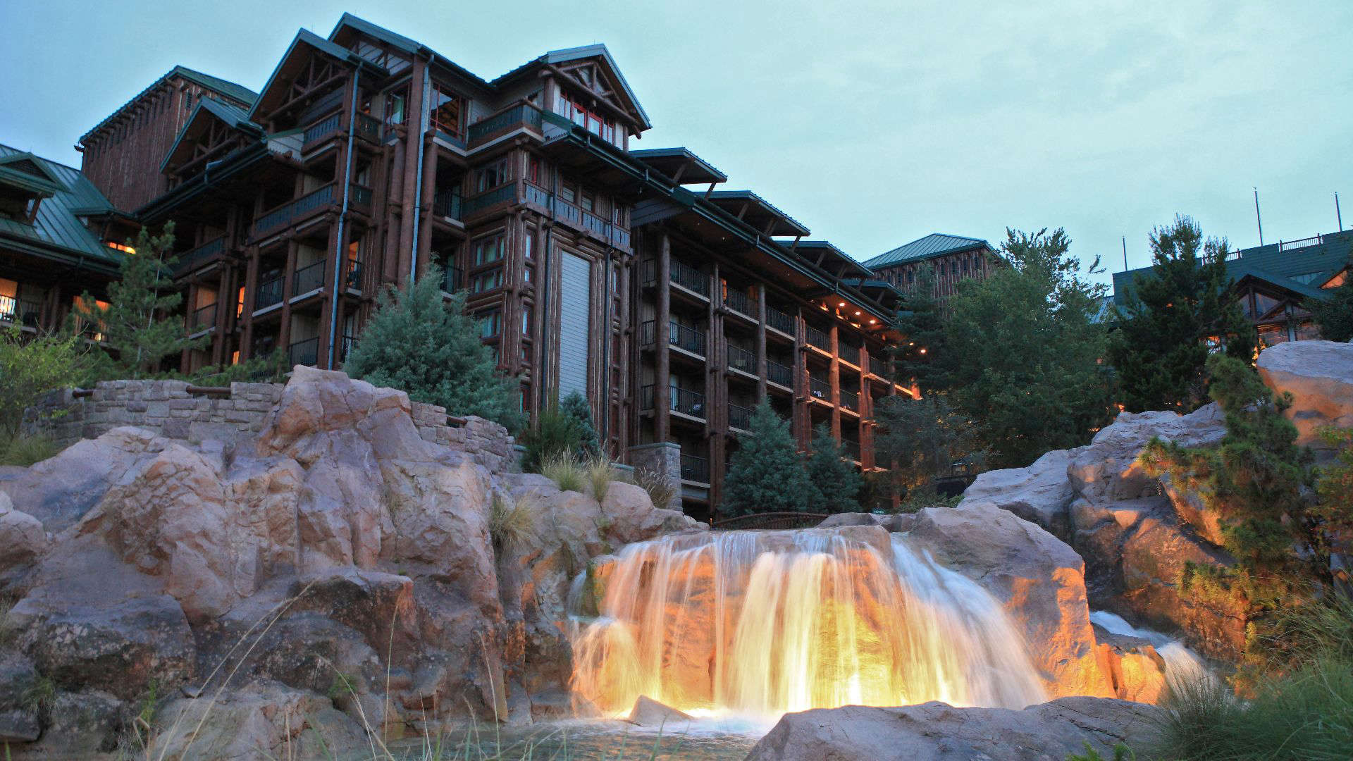 Disney Wilderness Lodge resort with rustic lodge architecture and waterfall, one of the best hidden gem Disney resorts offering a peaceful, scenic stay near Magic Kingdom.