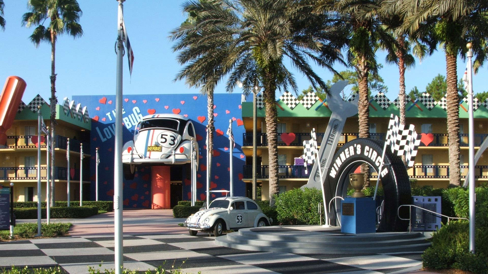 "Disney’s All-Star Movies Resort featuring giant Herbie the Love Bug and colorful themed icons, one of the most budget-friendly Disney World resorts with fun family theming.