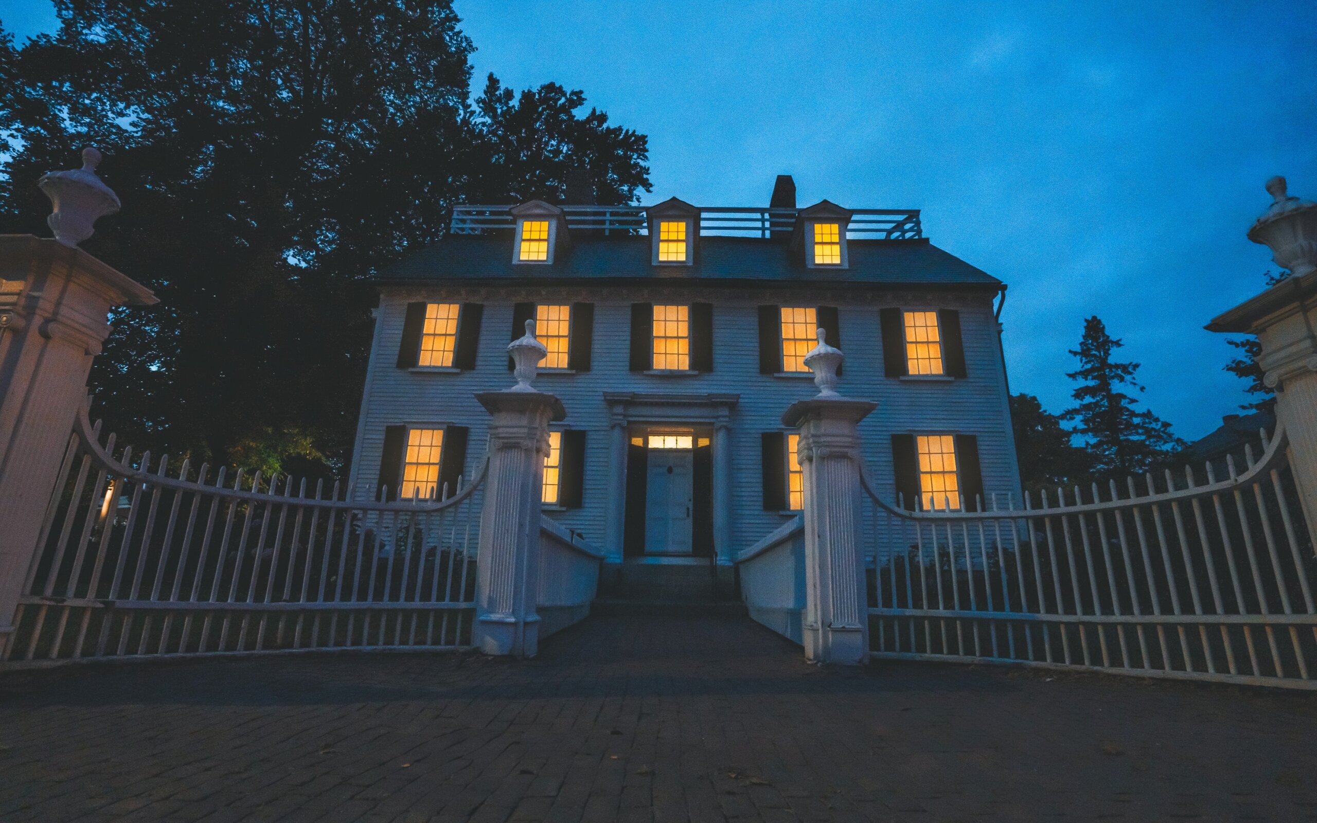 Salem, Massachusetts - October 20, 2020: Low Angle The Ropes Mansion Haunted House Halloween at Night Window Lights On Horror Scary Historic Home