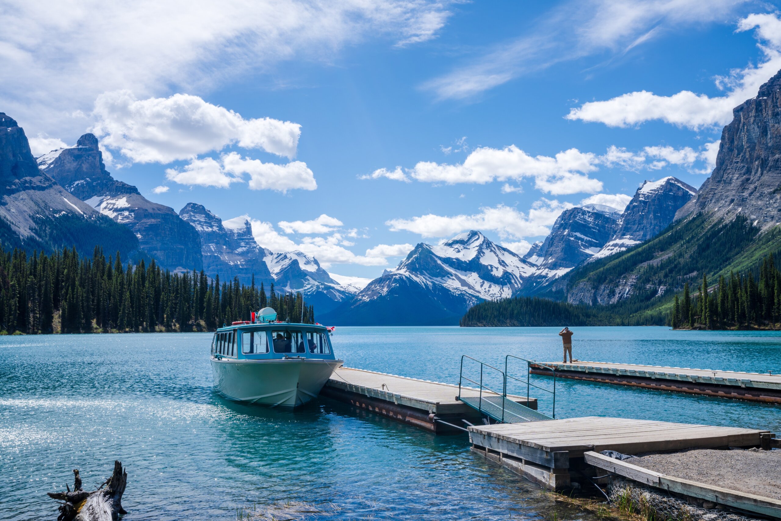 Maligne Lake Cruise boat pier at spirit island. Maligne Lake summer scenery reflected on the water. Jasper National Park, Alberta, Canada. Canadian Rockies.