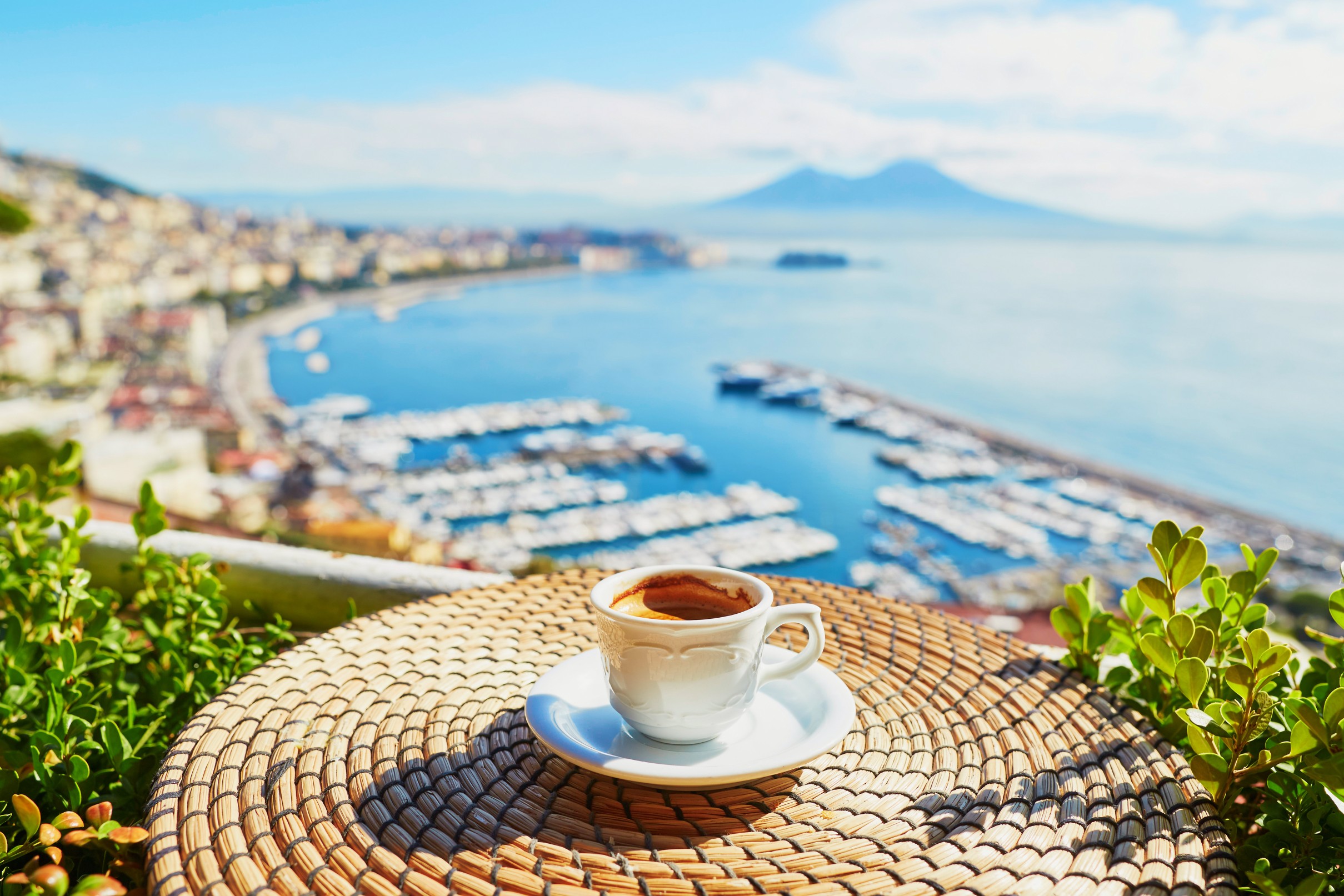 Cup of coffee with view on Vesuvius mount in Naples
