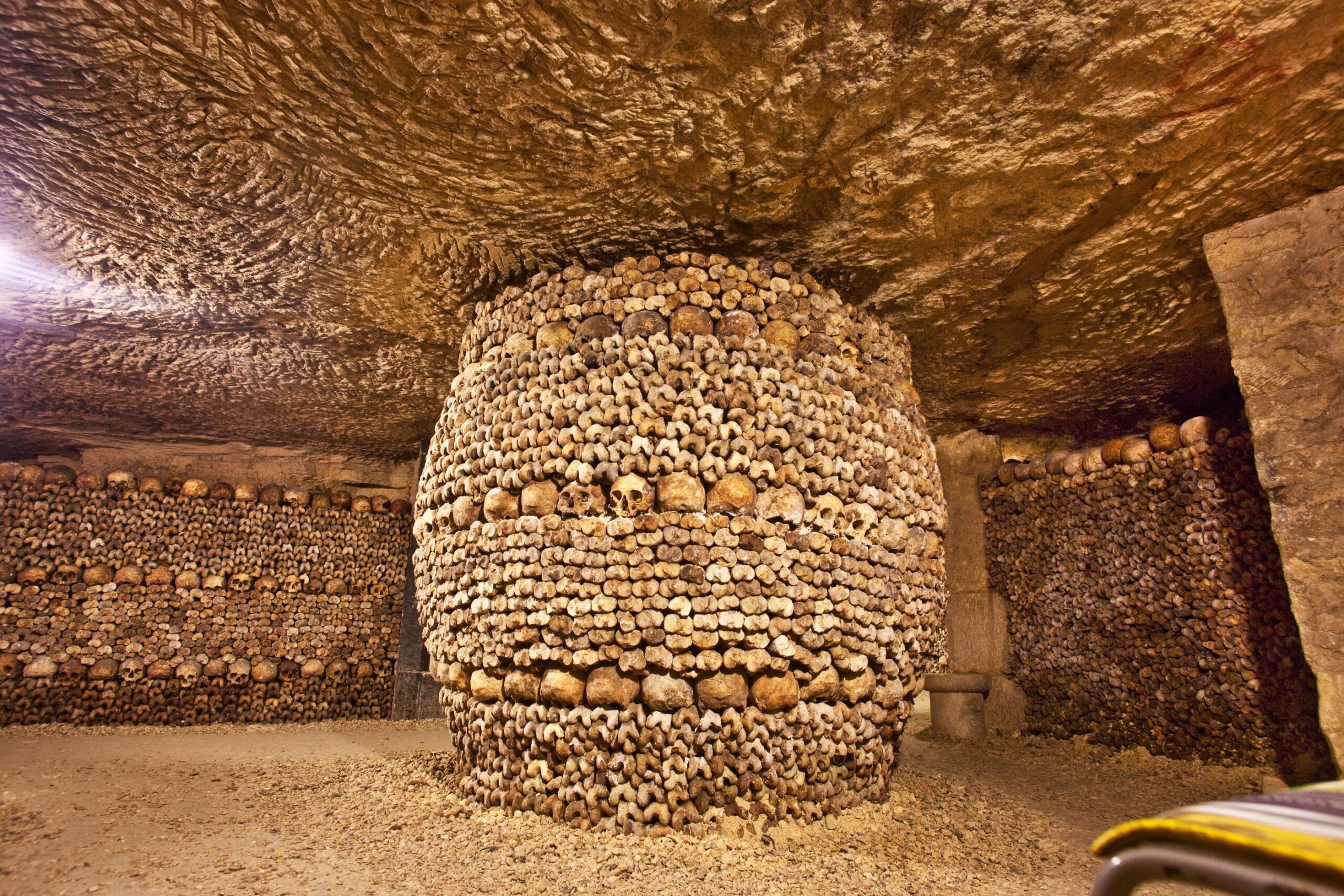 The Paris Catacombs house the remains of over six million people, arranged in eerie yet artistic displays beneath the streets of Paris.