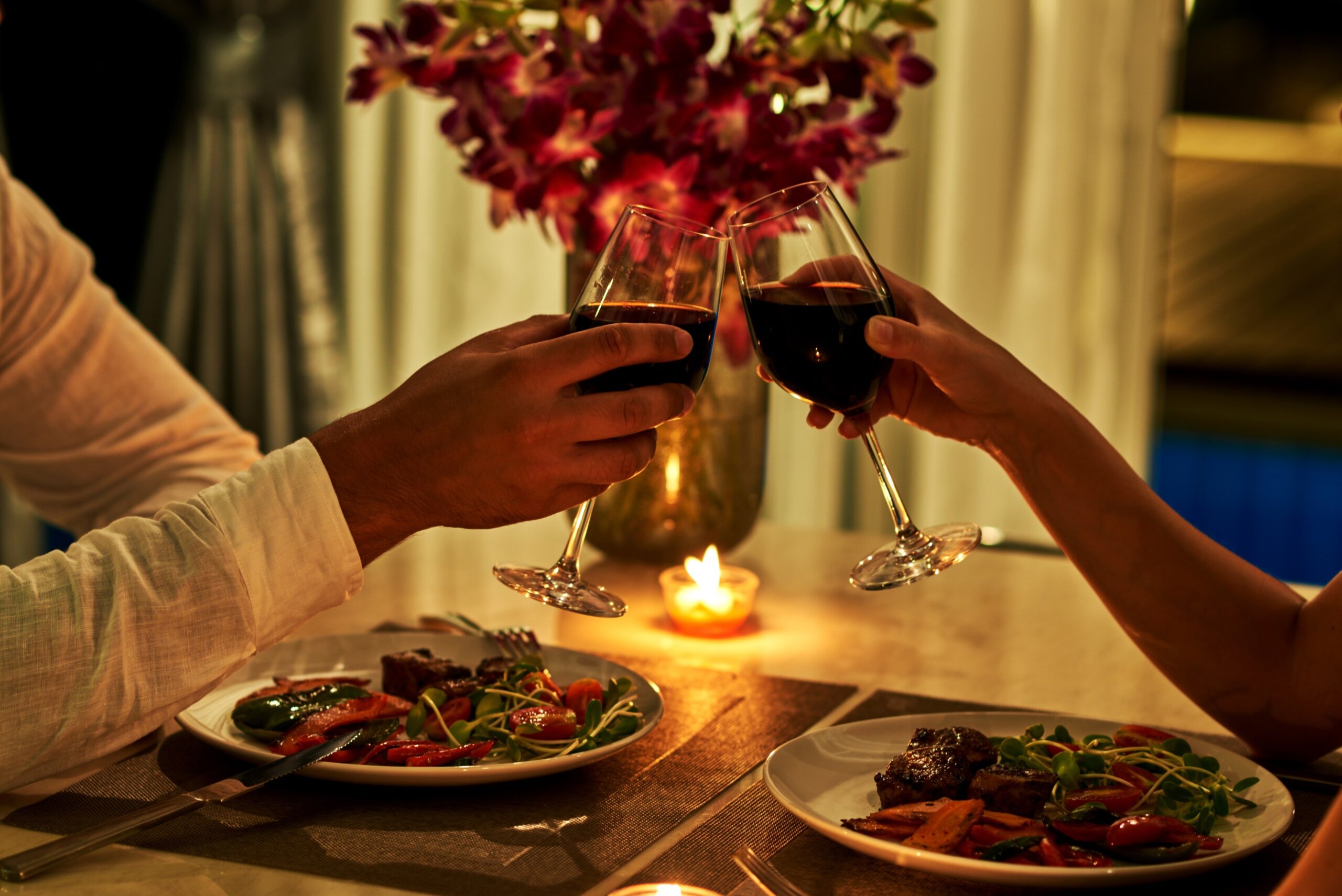 Happy couple on summer evening having romantic dinner.
