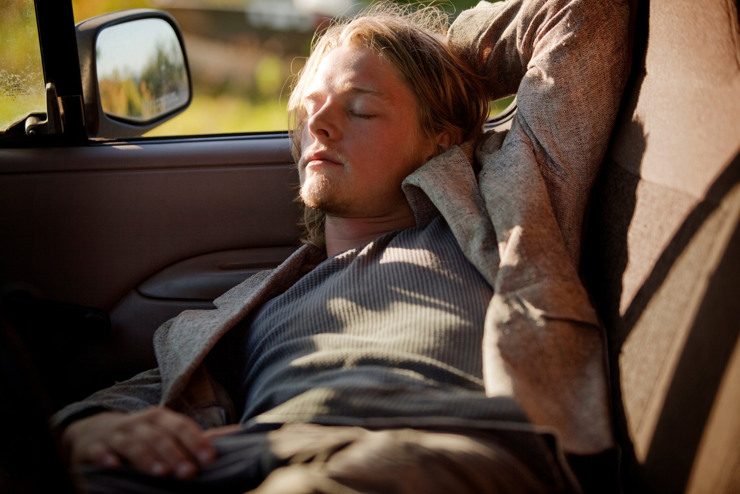Man sleeping in car
