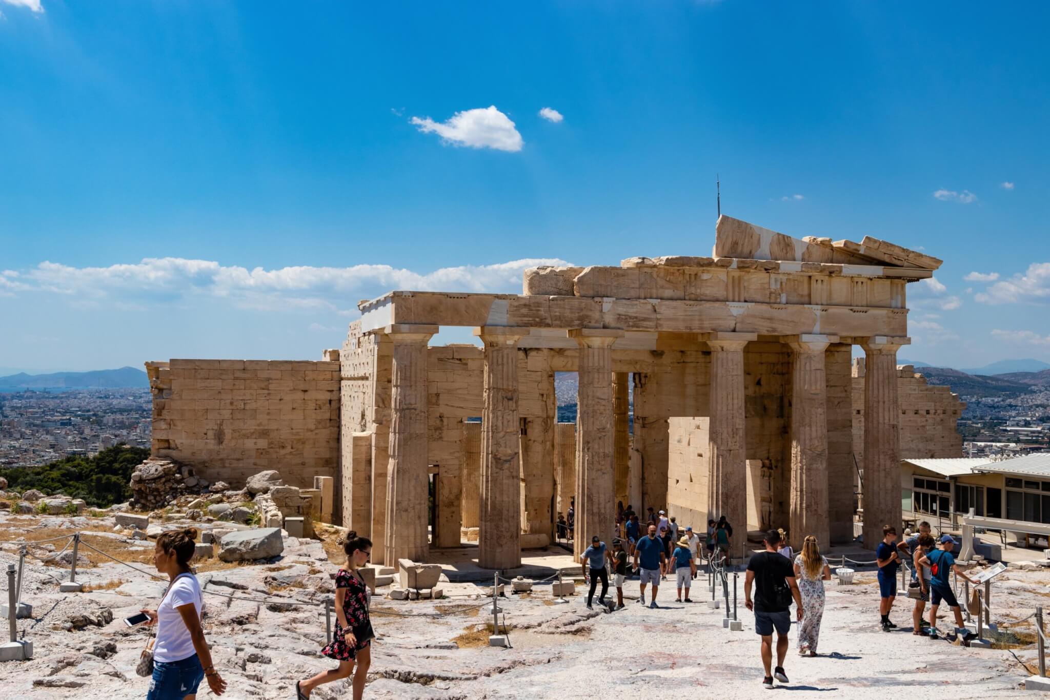 crowded with tourist's acropolis of Athens. The main gateway, a propylaea, propylea or propylaia in sunny day