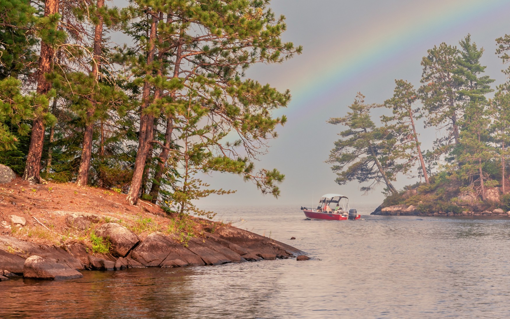 People are enjoying fishing and boating under sunset on Crane Lake, Voyageurs National Park, Minnesota

