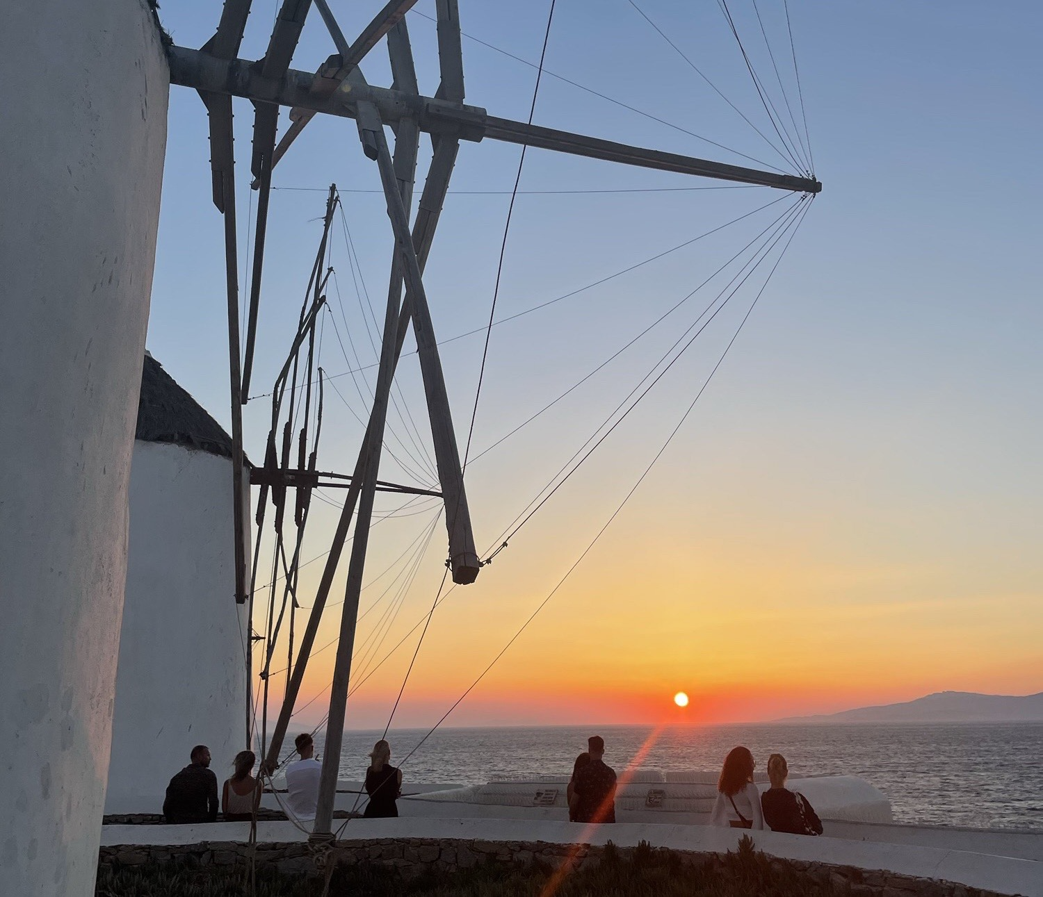 Bright red sunset from the windmills of Mykonos.
