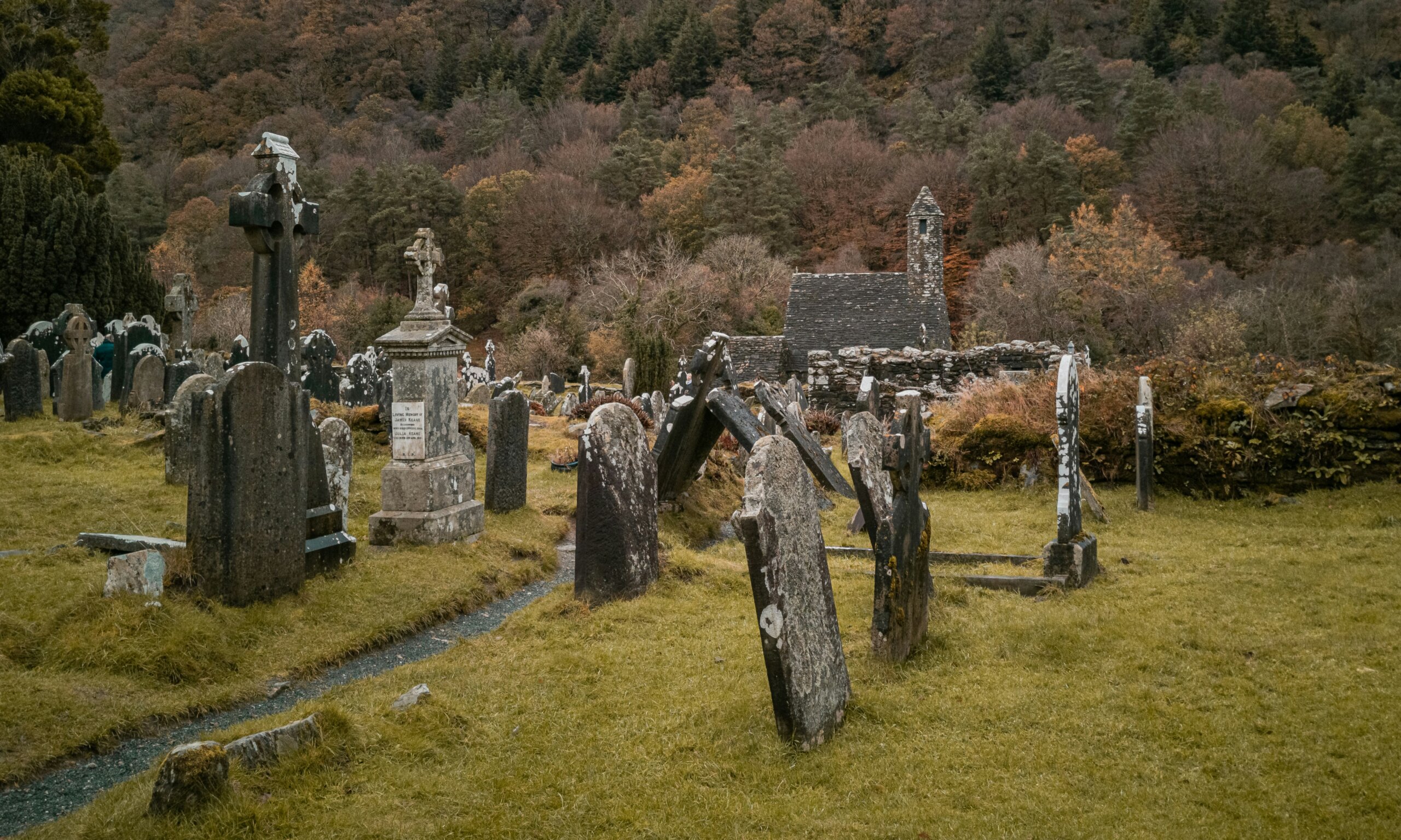 Irish castle in autumn surrounded by trees, symbolizing Halloween festivals and Samhain celebrations in Ireland.